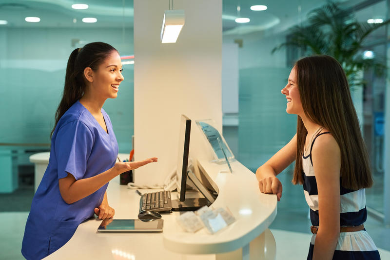 Health worker serving a customer at a generic health clinic
